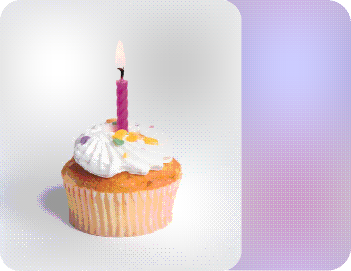 Cupcake with cream and lighting candle on top, and other background shapes